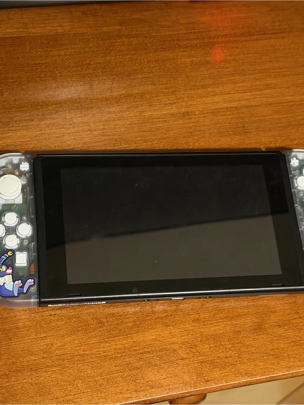 Nintendo Switch with Clear Shell and Pink Screen Artwork